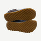 Bottega Veneta Orbit sneakers outsole view showing chevron gum rubber tread and brand stamp.