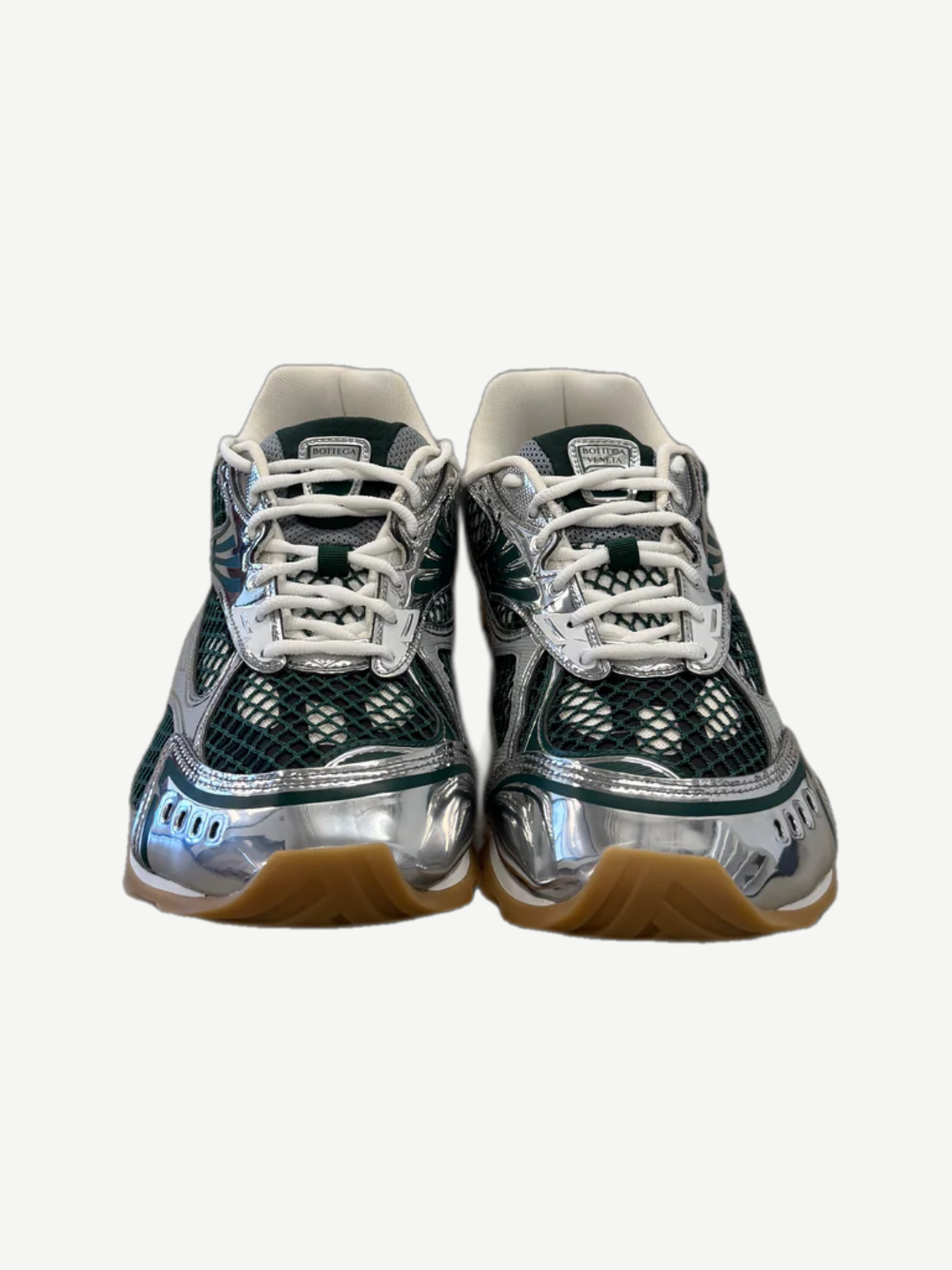 Bottega Veneta Orbit sneaker pair top view with billiard green uppers, silver hardware and bubble bottom sole