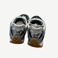 Bottega Veneta Orbit sneaker rear angle view showing sculpted silver heel cup and billiard green leather panels