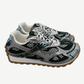 Bottega Veneta Orbit sneaker side view in billiard green leather with silver metallic accents and chunky sole