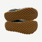 Bottega Veneta dark green Orbit sneakers angled pair view showing low-top silhouette and laces.
