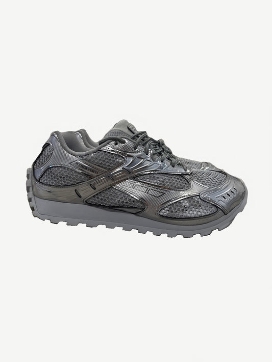 Bottega Veneta Orbit sneaker side profile in metallic silver with mesh panels and chunky lugged sole