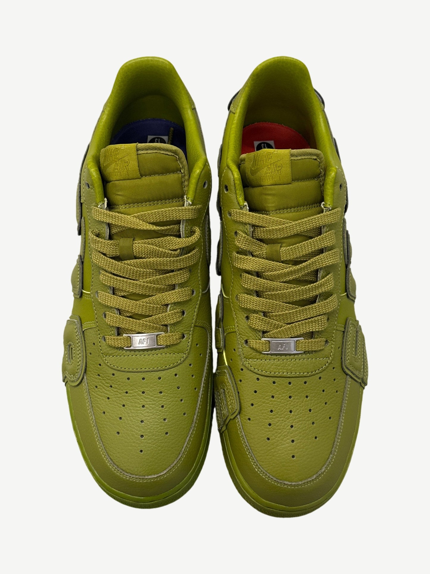 CPFM Moss Nike Air Force 1 top down view showing tonal green tongue tag and woven lace pattern.