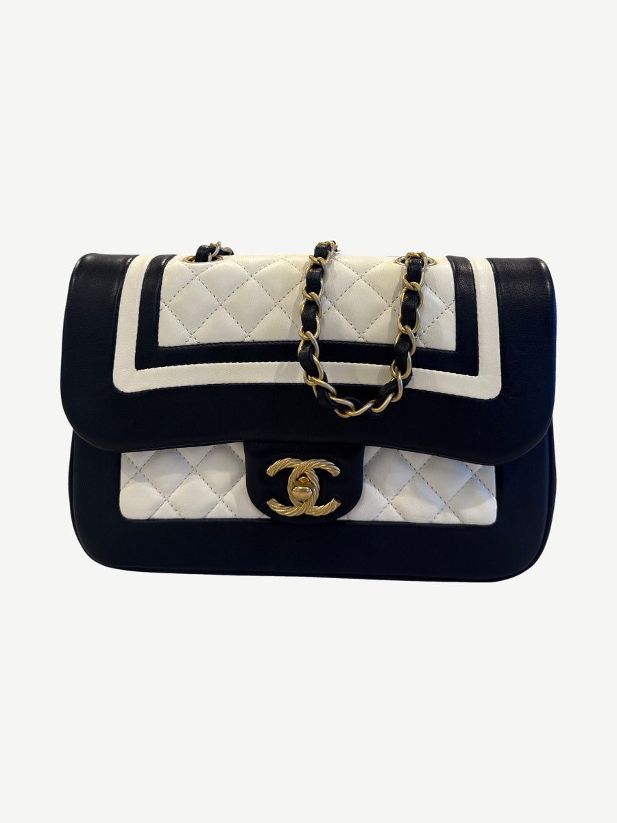 Chanel Paris Cosmopolite small bicolor black and white quilted lambskin flap bag with aged gold CC turnlock