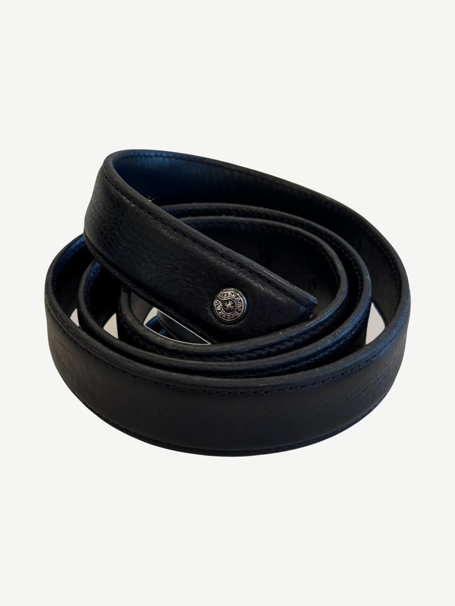 Chrome Hearts 1 inch black leather belt strap coiled showing silver dagger cross button hardware accent