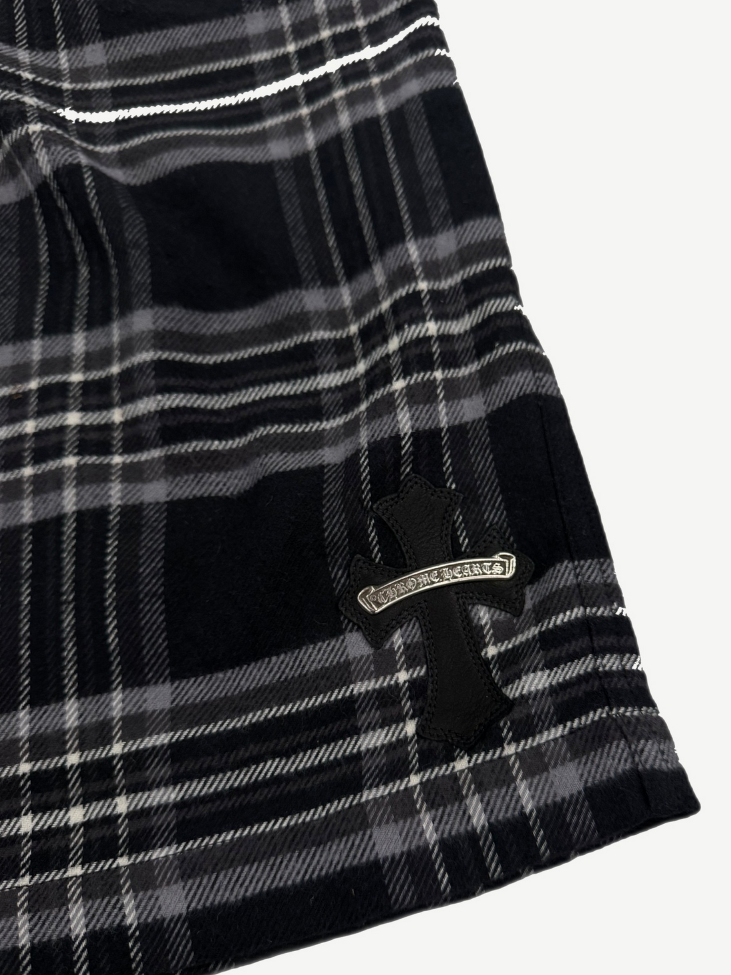 Chrome Hearts After School flannel shorts detail, black leather CH cross patch on plaid pocket
