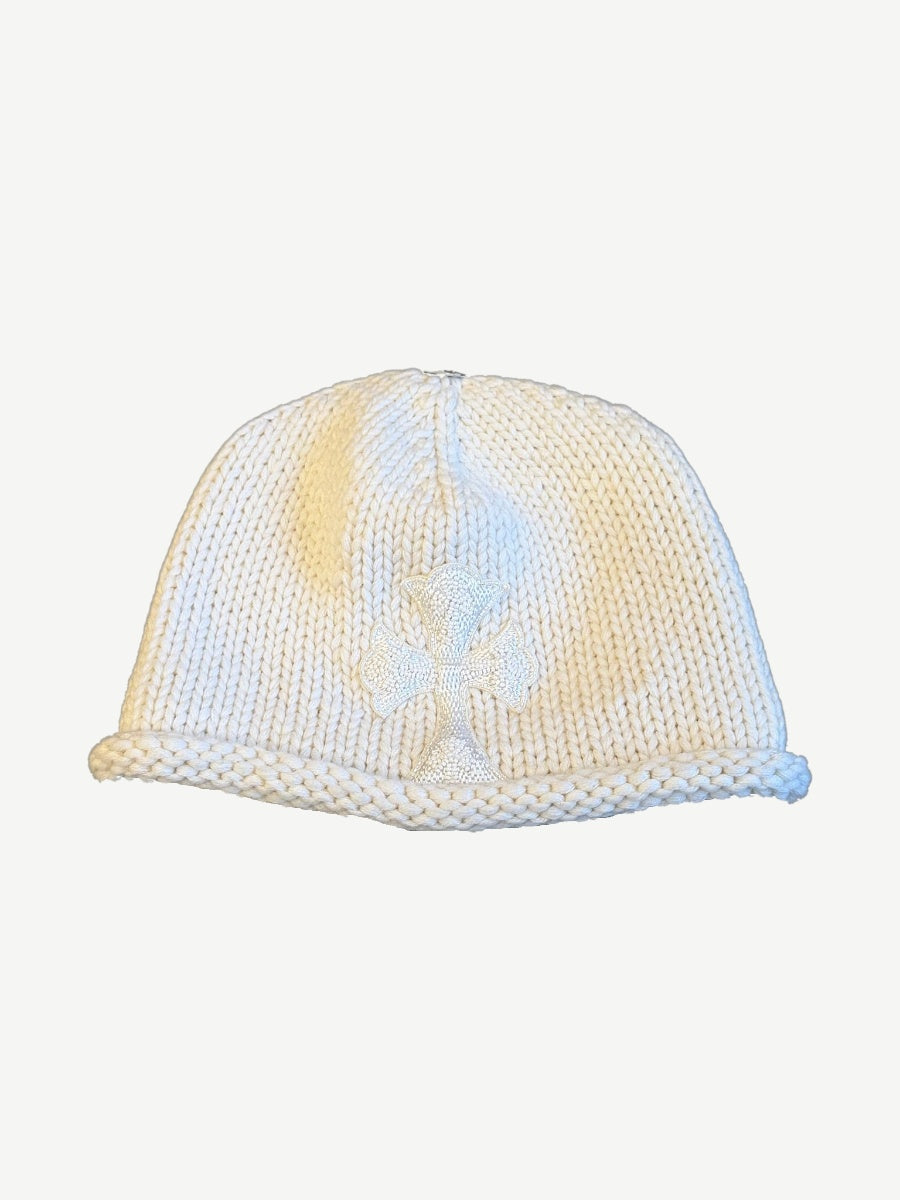Chrome Hearts cream chunky knit beanie with tonal beaded cross emblem stitched to front and rolled cuff.