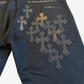 Chrome Hearts cross patch chinos rear detail close-up of layered black leather crosses on back pocket