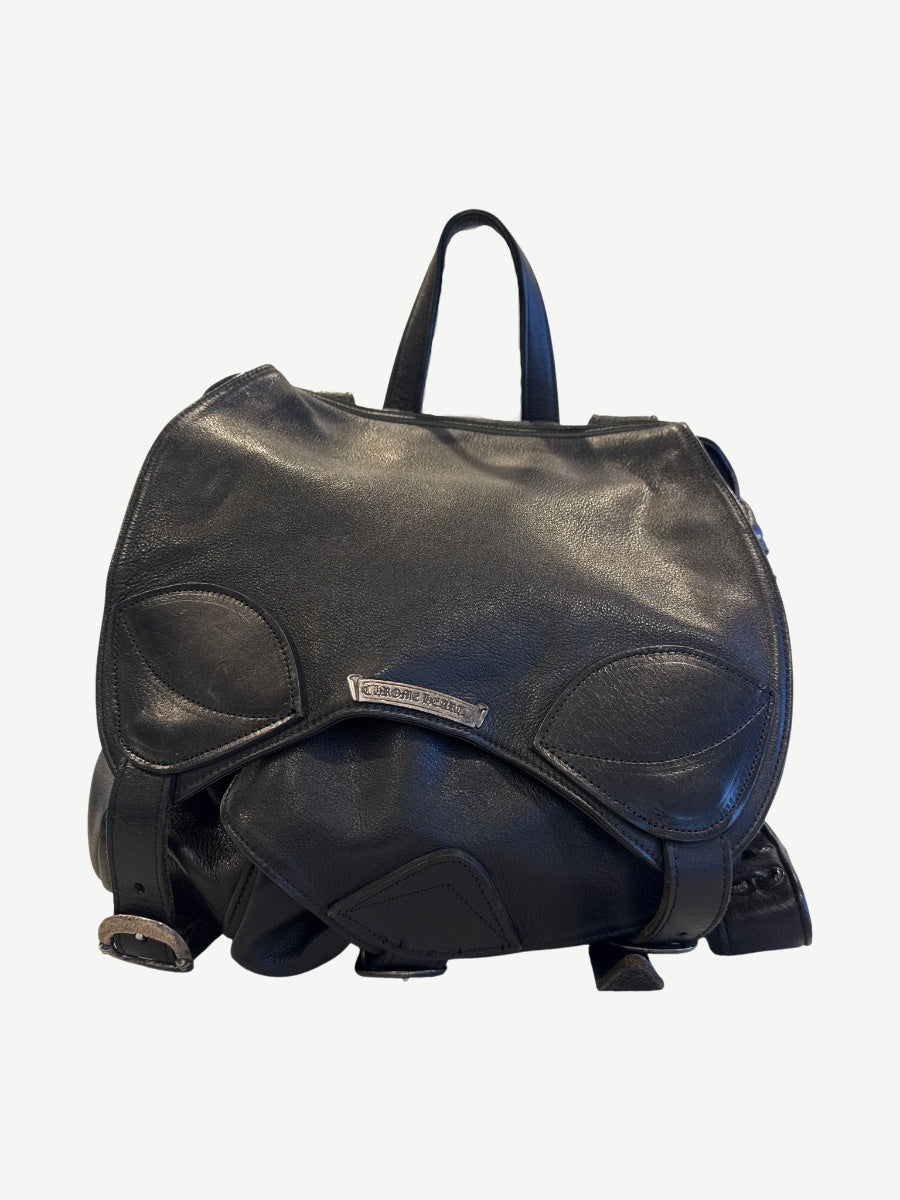 Chrome Hearts black Gunslinger backpack front view with embossed leather cross patches and silver buckles