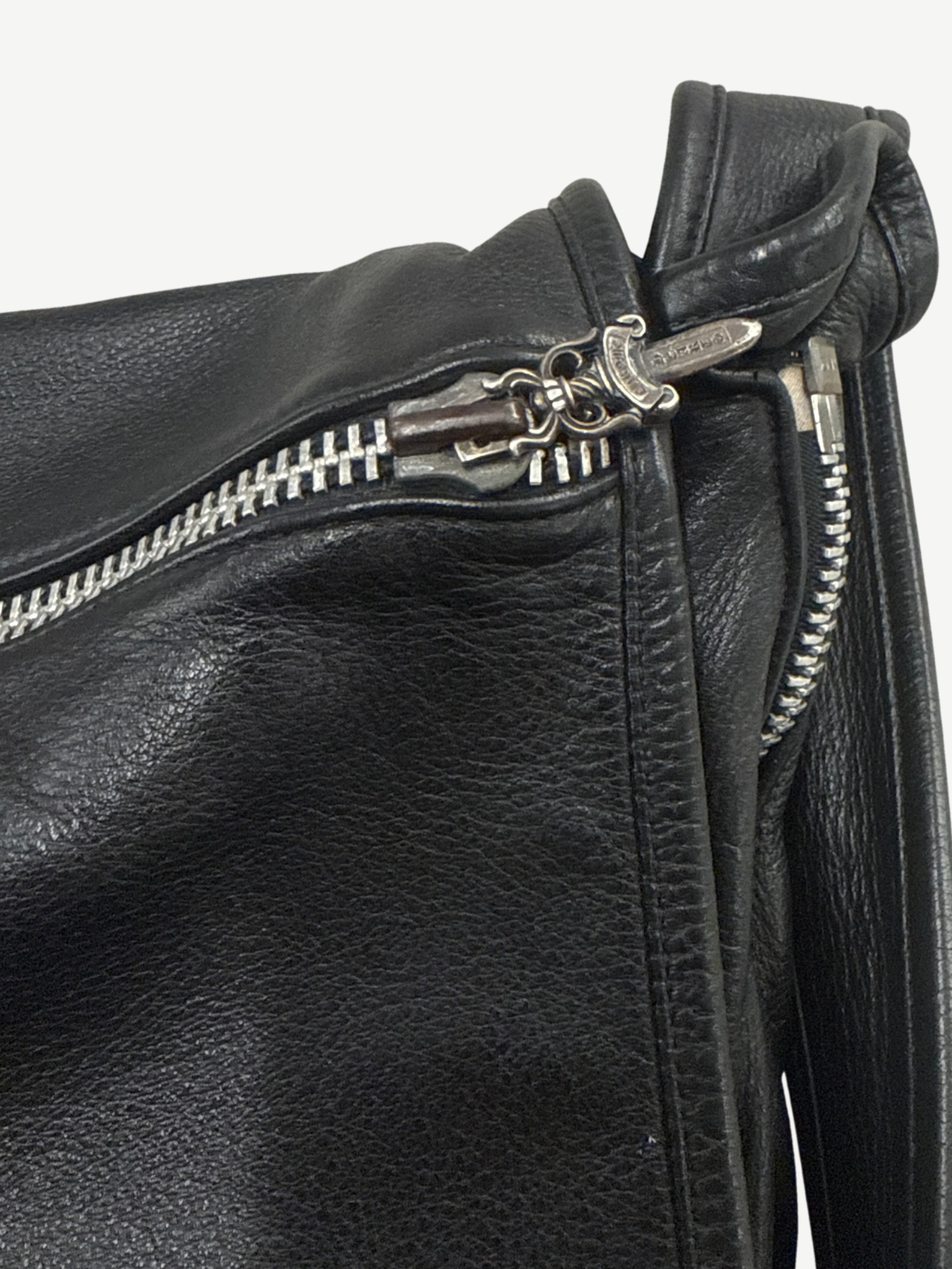 Chrome Hearts black leather Gunslinger messenger bag side view showing adjustable strap and hardware