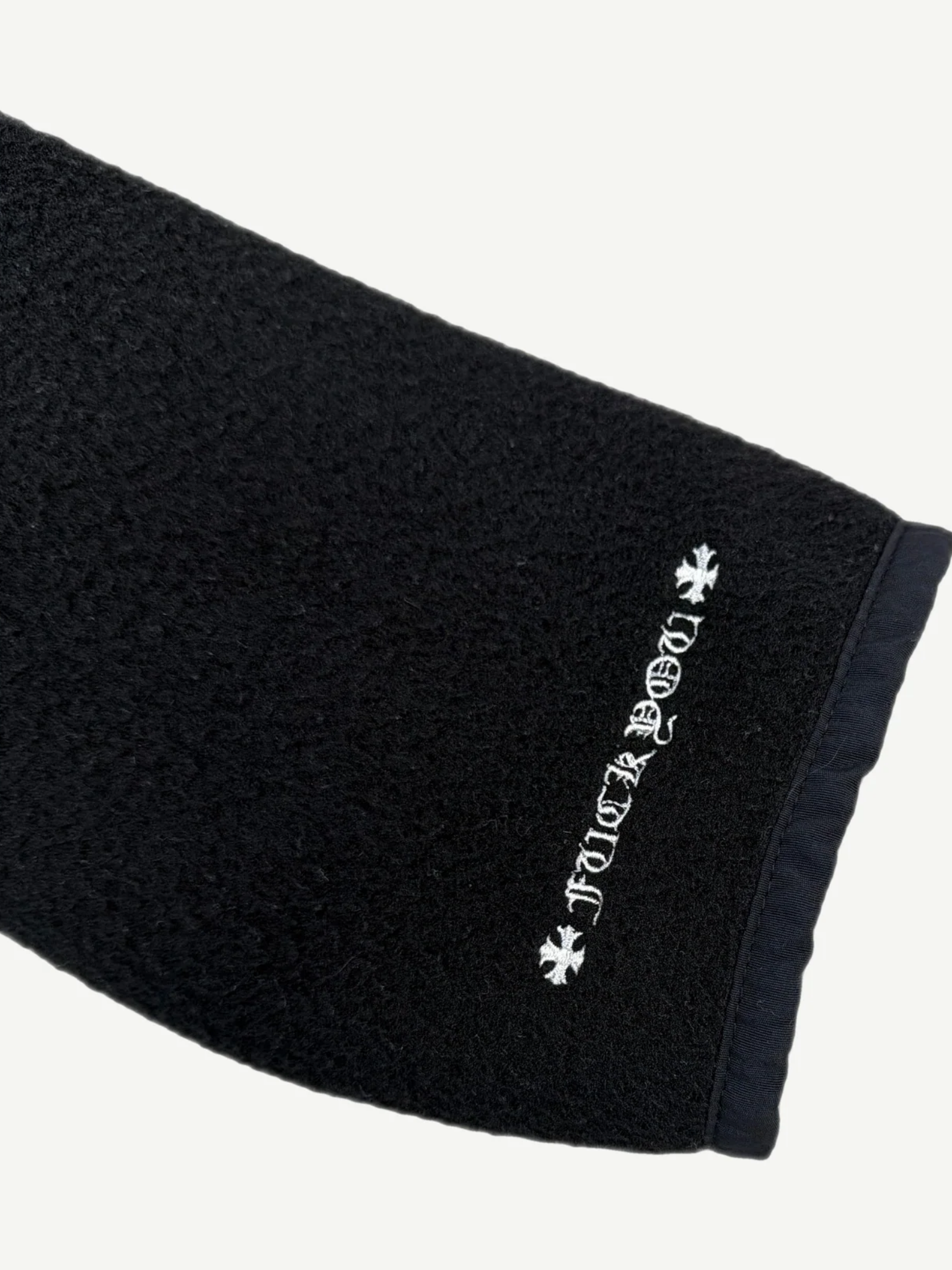 Chrome Hearts black horseshoe fleece hoodie laid flat, full silhouette of plush black sherpa shell