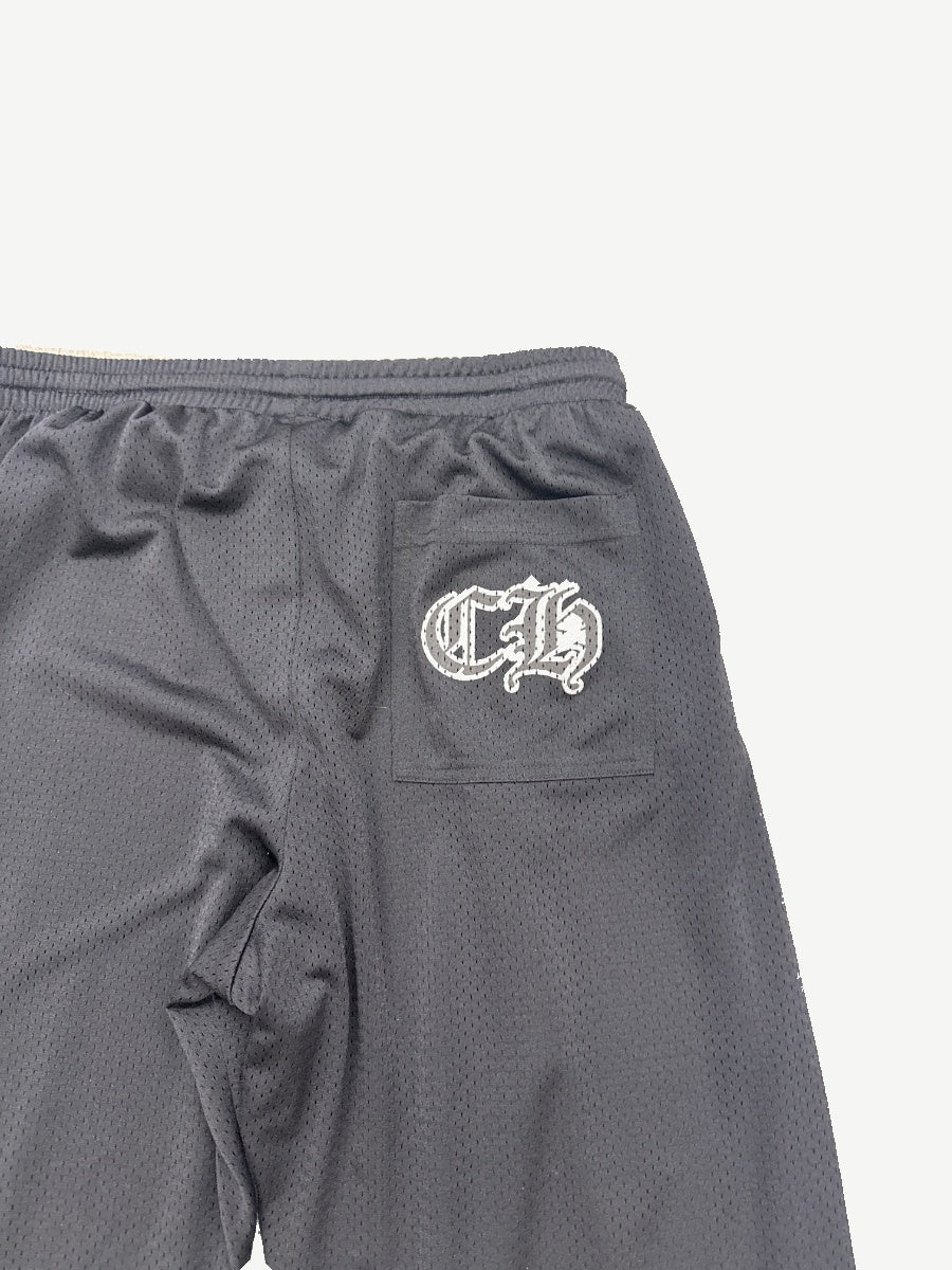 Close-up of Chrome Hearts mesh sweatpants rear waistband with white CH gothic logo embroidered pocket