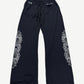 Chrome Hearts black mesh warm up sweatpants with white floral cross dagger embroidery on both legs, front view