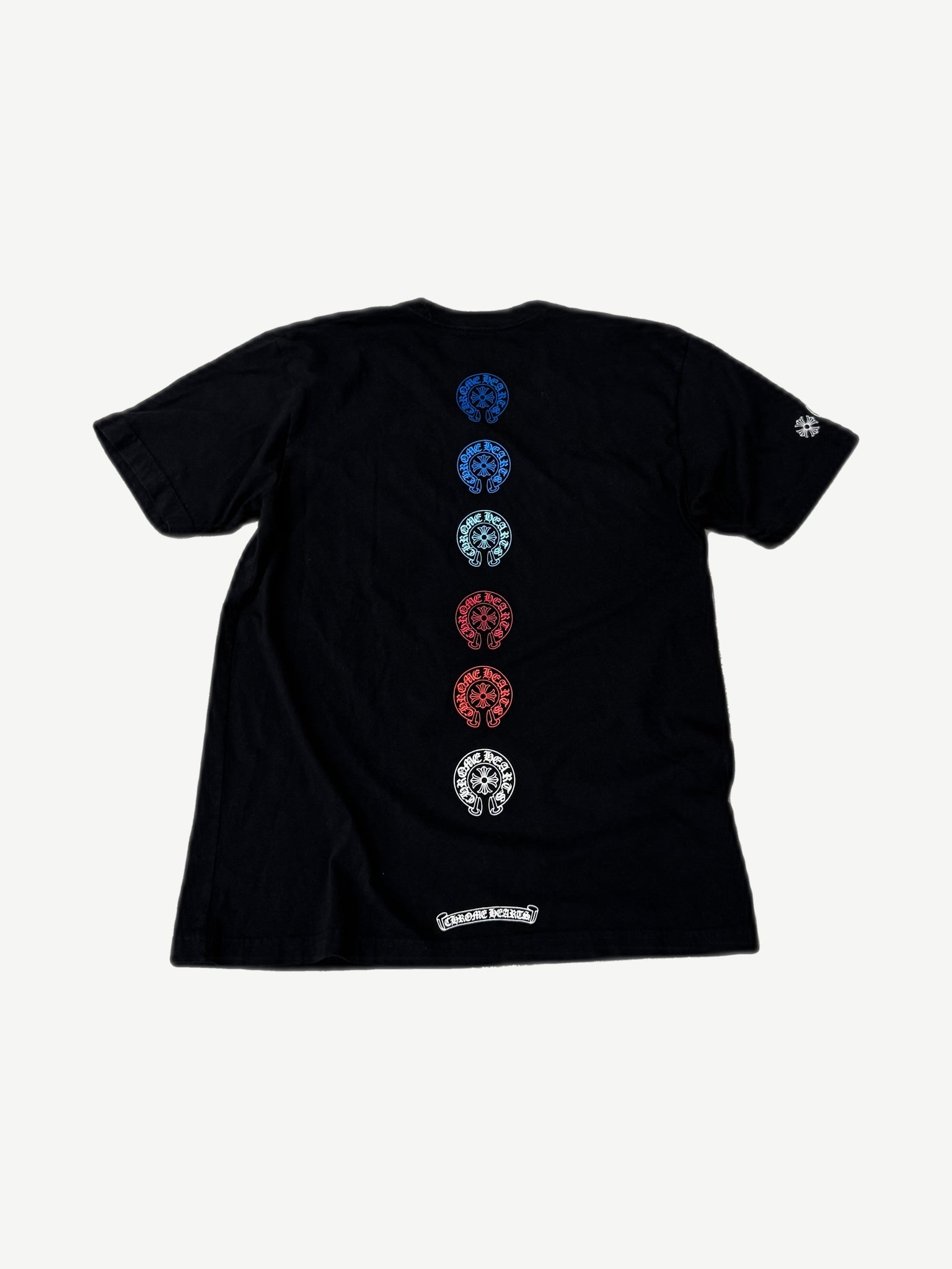 Chrome Hearts horseshoe tee back view with vertical multicolor horseshoe column and scroll banner.