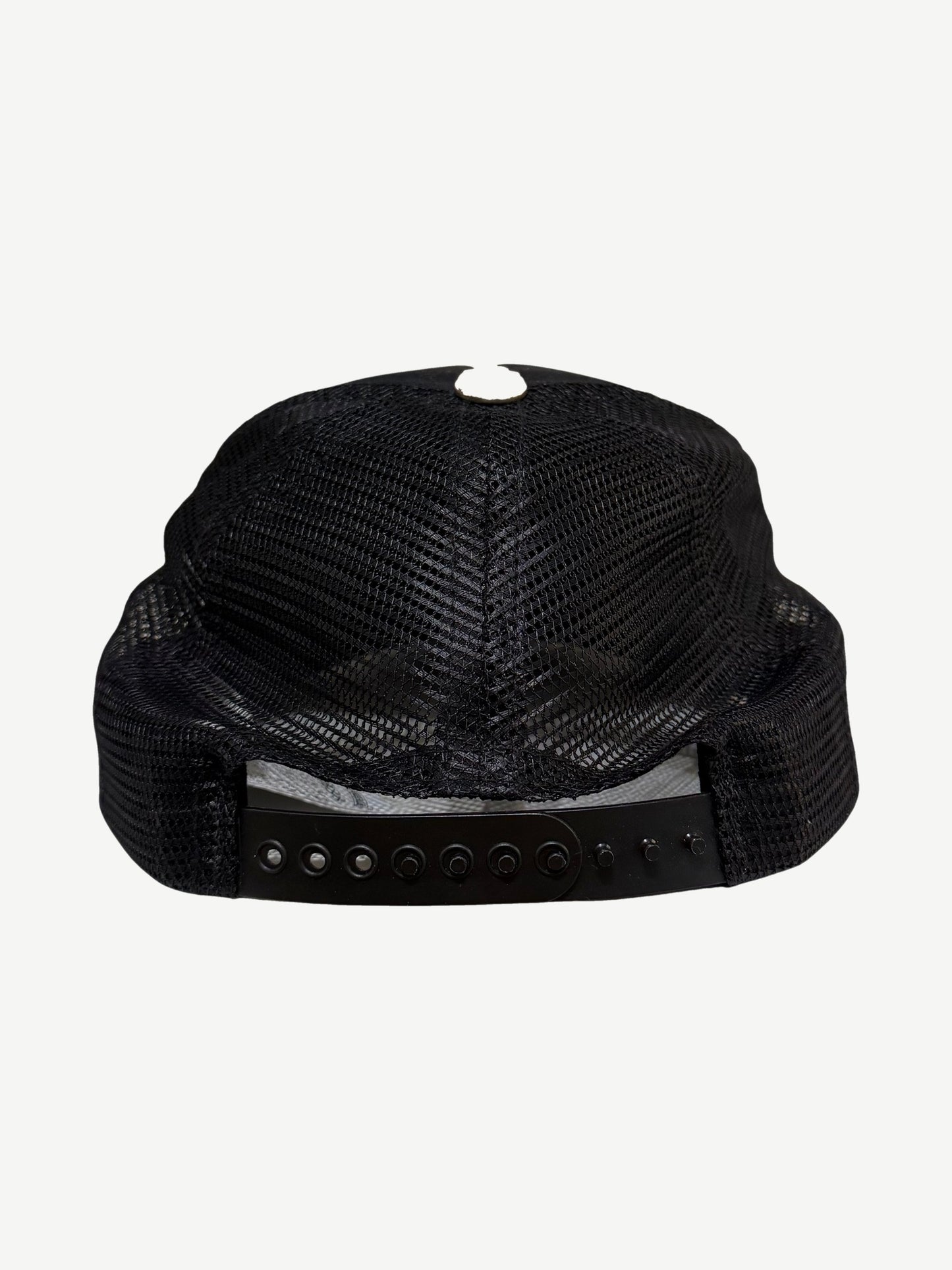Chrome Hearts NYC CH trucker hat back view in black mesh with adjustable plastic snapback closure.