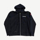 Chrome Hearts black zip hoodie front with small chest scroll logo and red cross patch on right sleeve