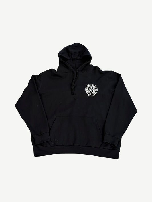 Chrome Hearts Paris horseshoe hoodie front in black with embroidered white horseshoe logo on left chest