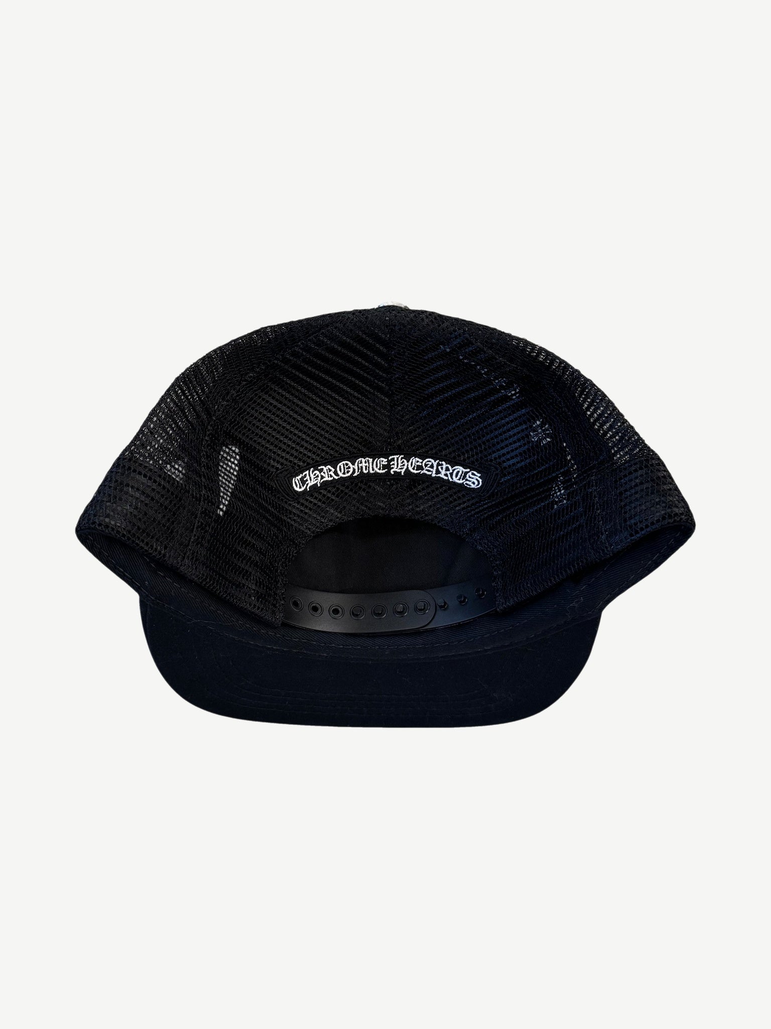 Chrome Hearts black trucker hat back with mesh panels, embroidered Chrome Hearts script, snapback.