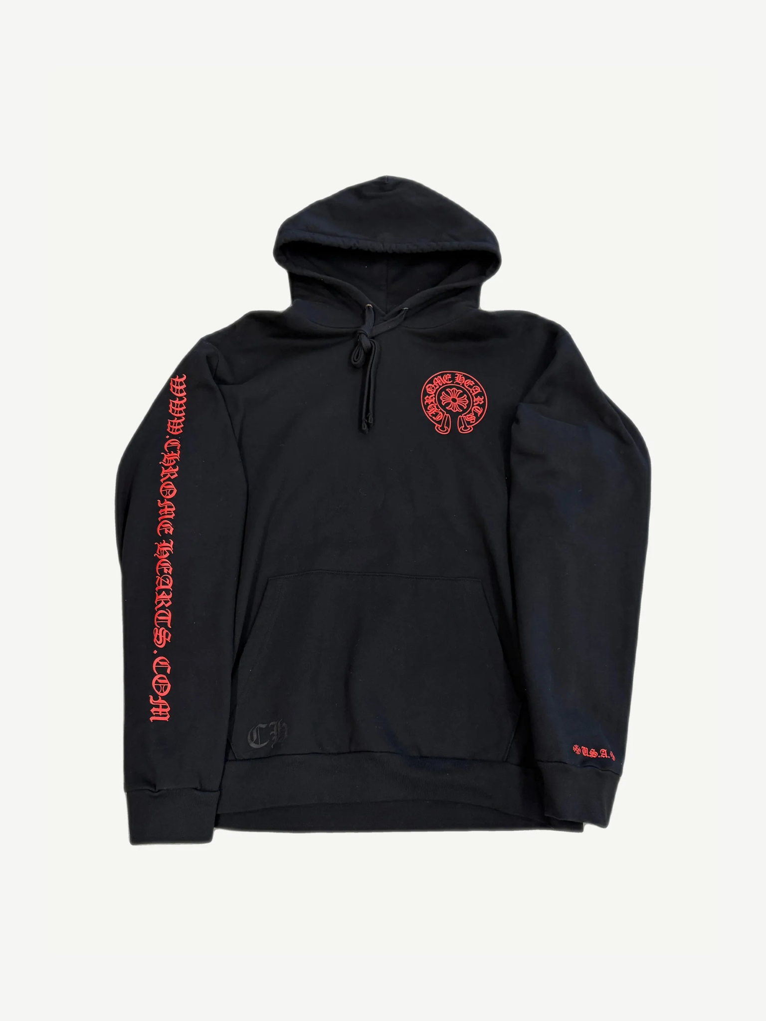 Chrome Hearts black pullover hoodie front with red horseshoe chest logo and red Chrome Hearts dot com print down sleeve.
