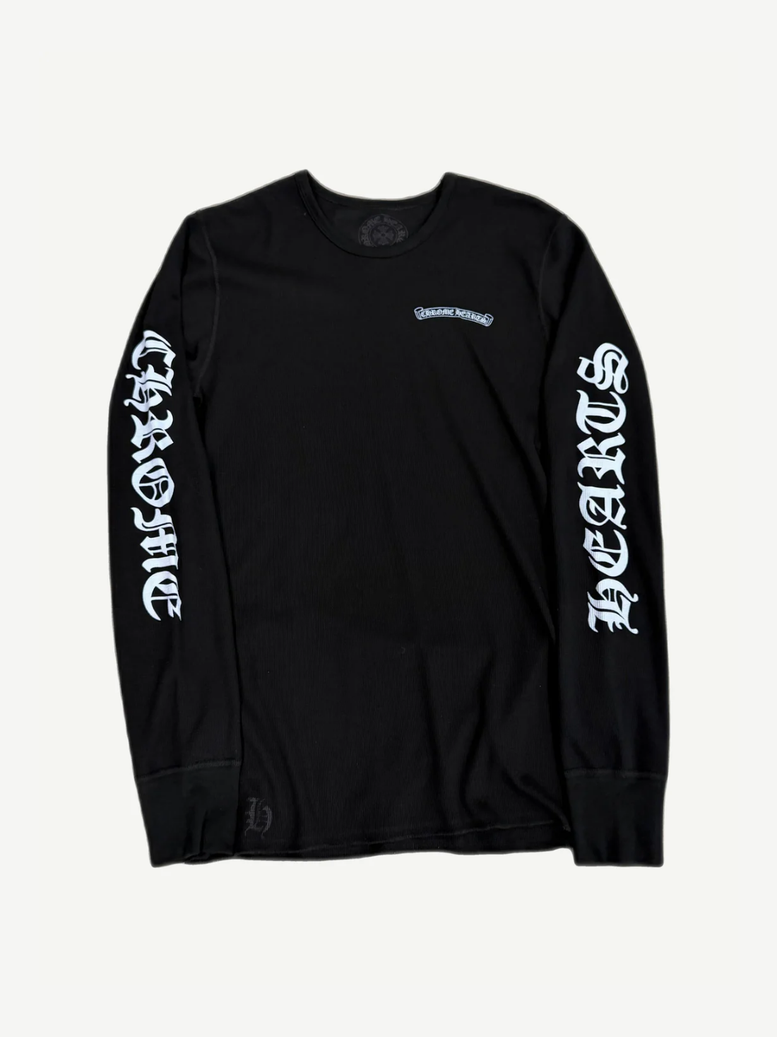 Chrome Hearts black waffle-knit thermal longsleeve with gothic scroll logo chest print and ribbed cuffs.