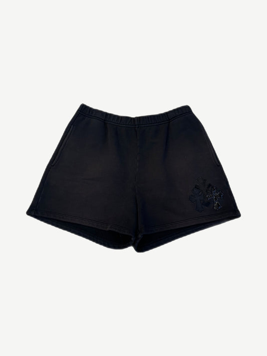 Chrome Hearts black sweat shorts with triple cross leather patches stacked on right leg, elastic waist front