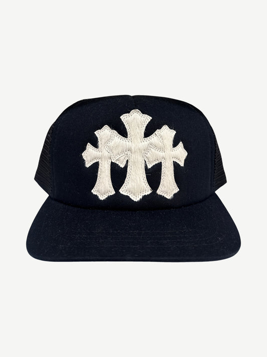 Chrome Hearts black trucker hat front with white pony hair triple cross patch and snapback closure detail.