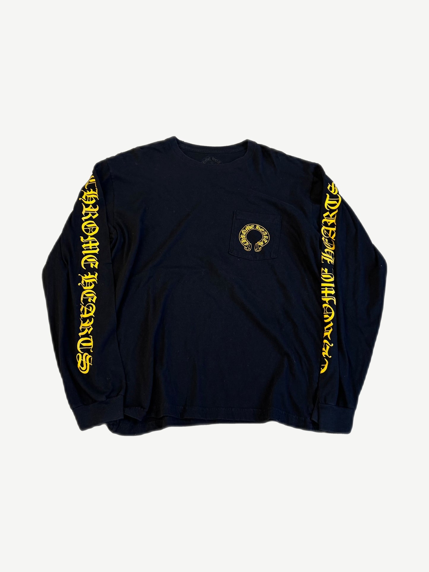 Chrome Hearts black longsleeve front with yellow horseshoe pocket logo and yellow gothic script down both sleeves