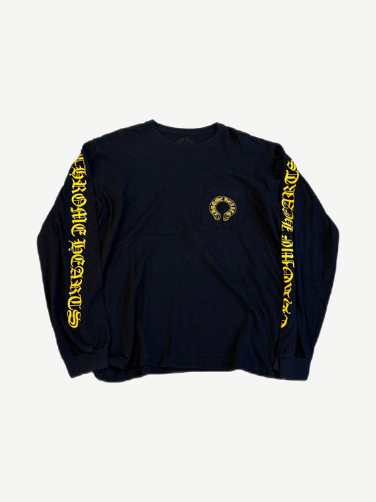 Chrome Hearts black longsleeve front with yellow horseshoe pocket logo and yellow gothic script down both sleeves