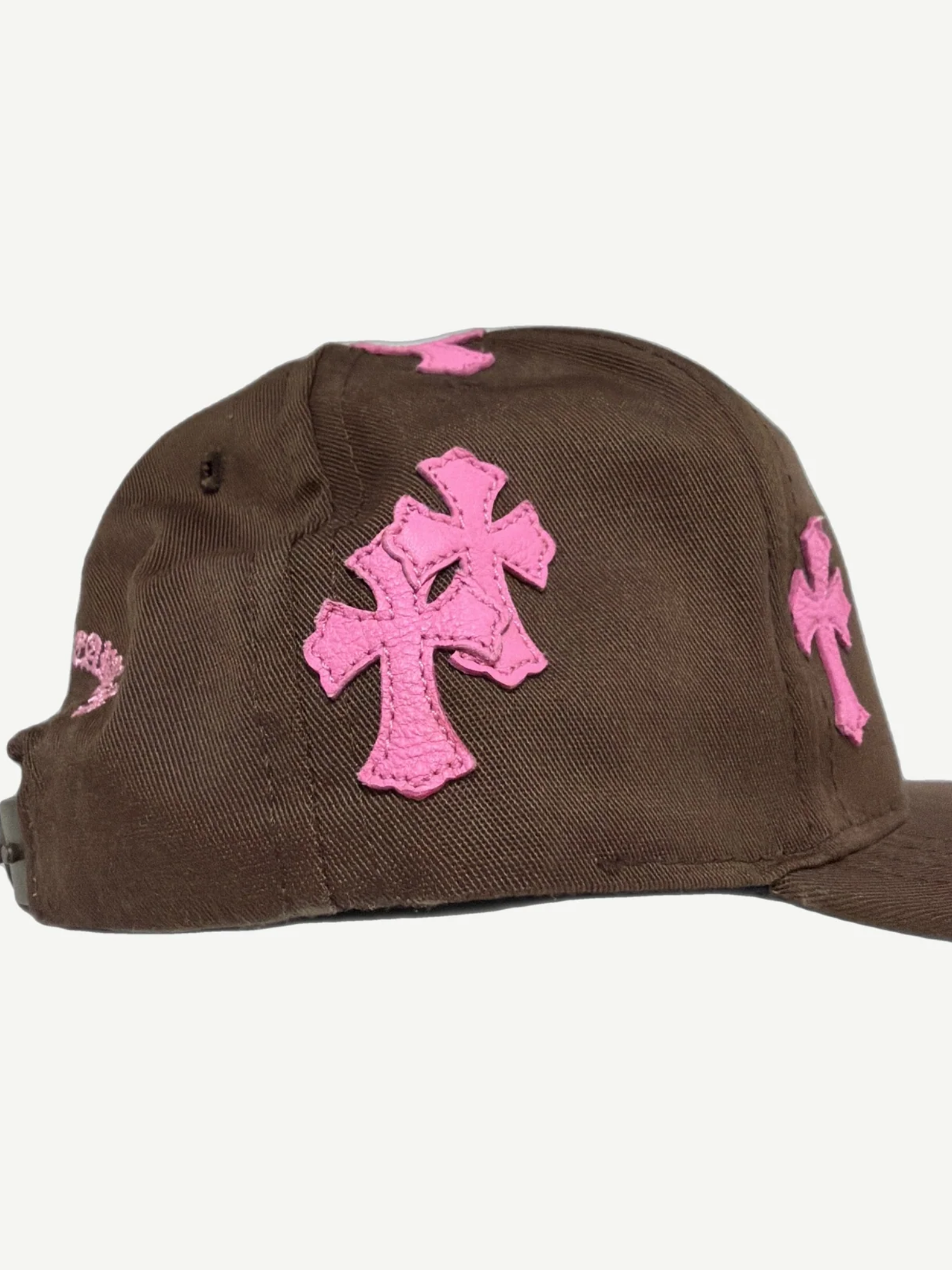 Chrome Hearts brown baseball hat back view, adjustable strap closure and pink leather trim
