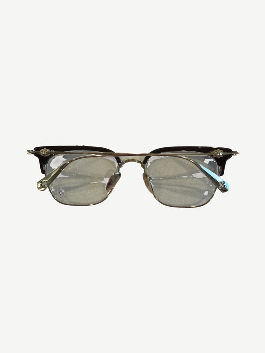 Front view of Chrome Hearts Sluntradiction clubmaster glasses showing brown brow bar and silver cross hardware