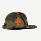 Chrome Hearts camo baseball cap side view with orange leather cross side panel patches
