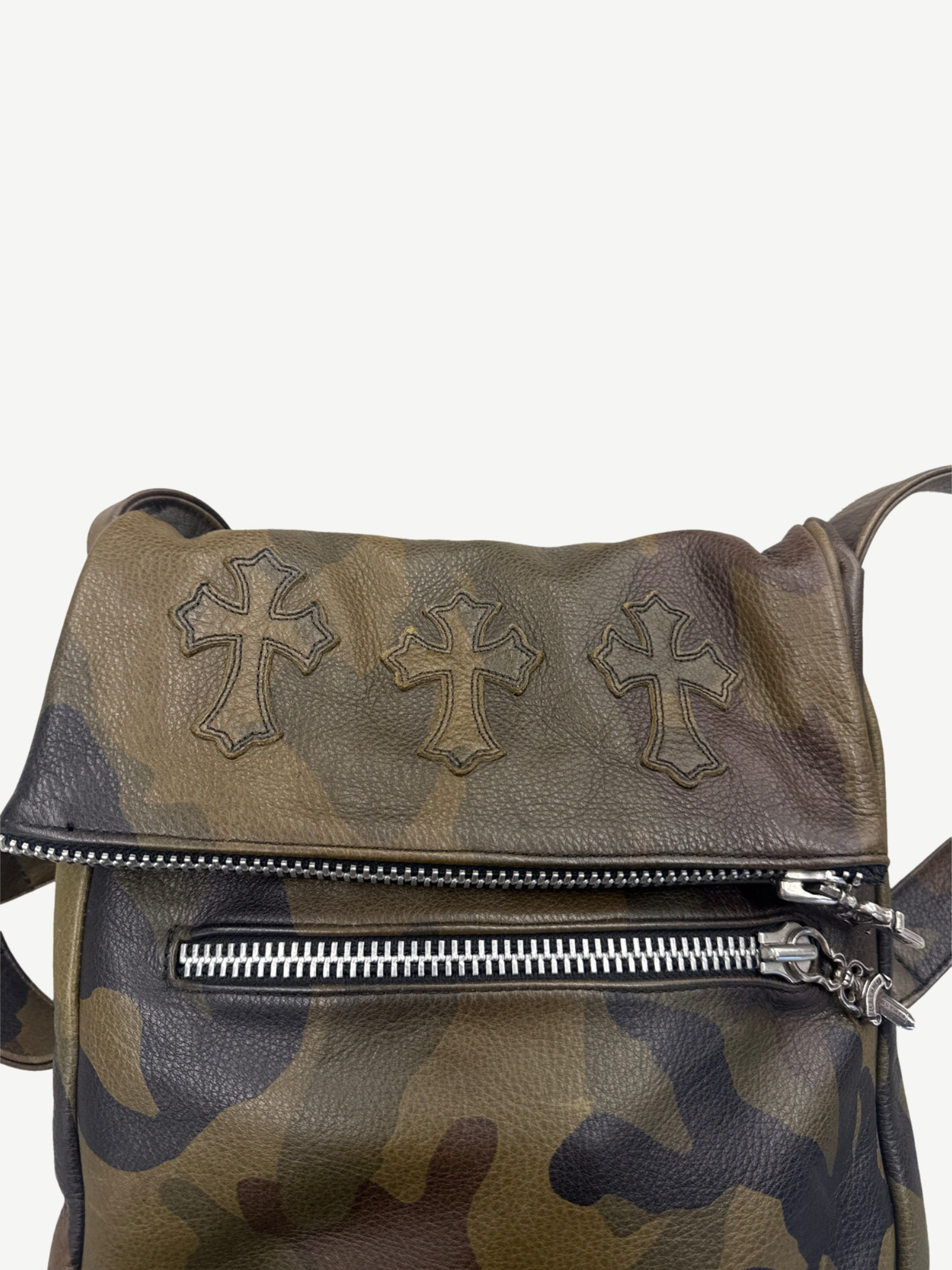 Chrome Hearts camo crossbody bag interior view with leather lining and Chrome Hearts engraved silver tag