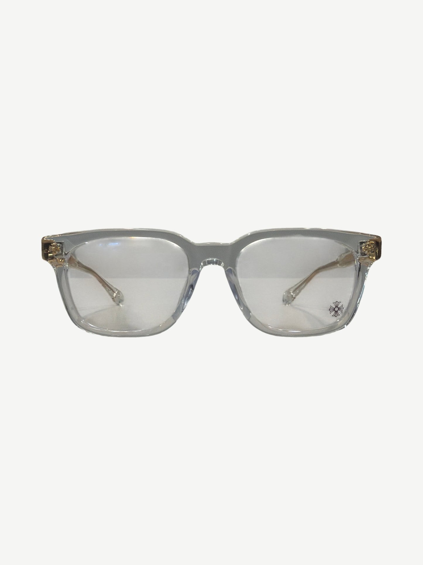 Chrome Hearts Cox Ucker eyeglasses, clear acetate frames with gold metal temple accents and dagger logo.