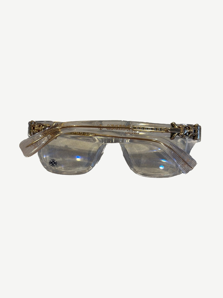 Chrome Hearts clear Vagillionaire glasses folded top view with gold temples and cross detailing