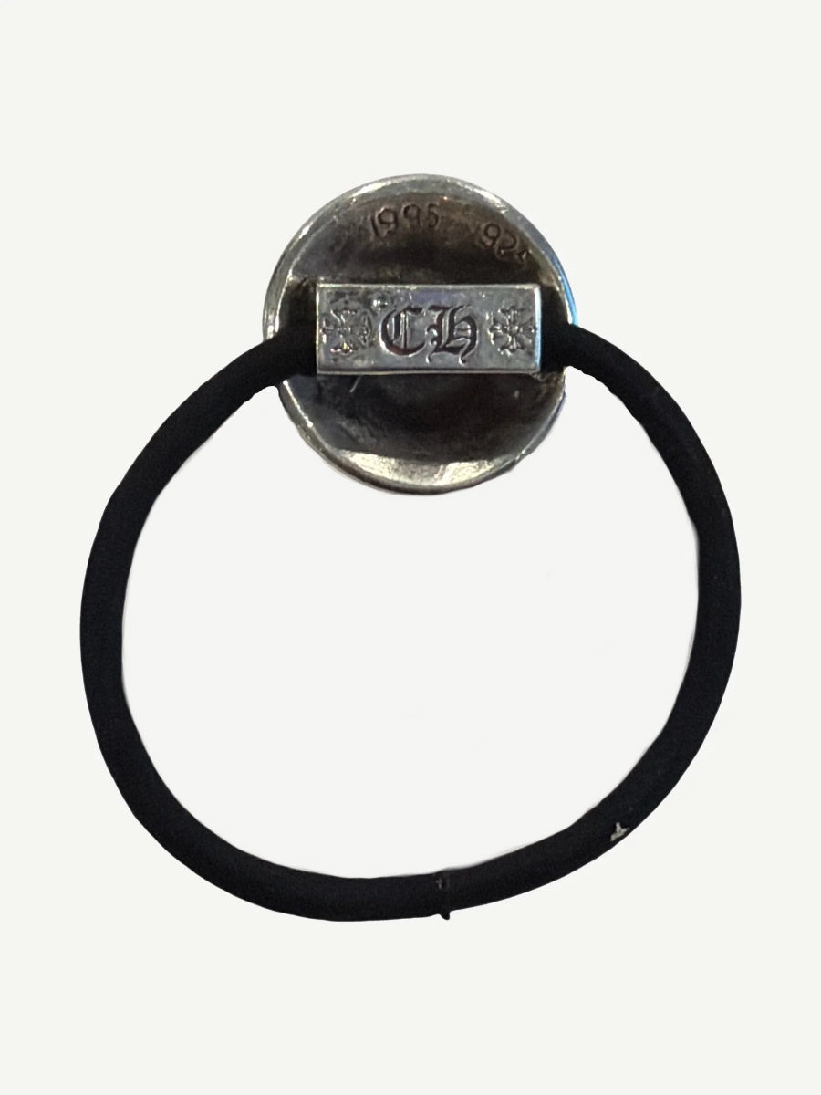 Back of Chrome Hearts silver hair tie charm showing CH gothic stamp and 925 sterling silver hallmark