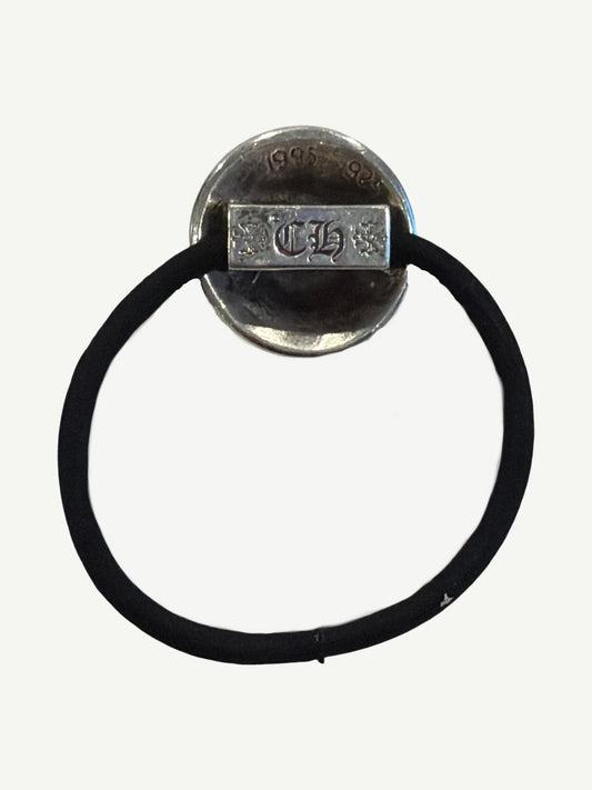 Back of Chrome Hearts silver hair tie charm showing CH gothic stamp and 925 sterling silver hallmark