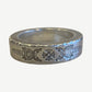 Chrome Hearts Dagger Spacer ring side view showing hand-engraved dagger flourishes and hammered silver edges.