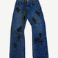Chrome Hearts dark wash jeans front, indigo denim with scattered black leather cross patches