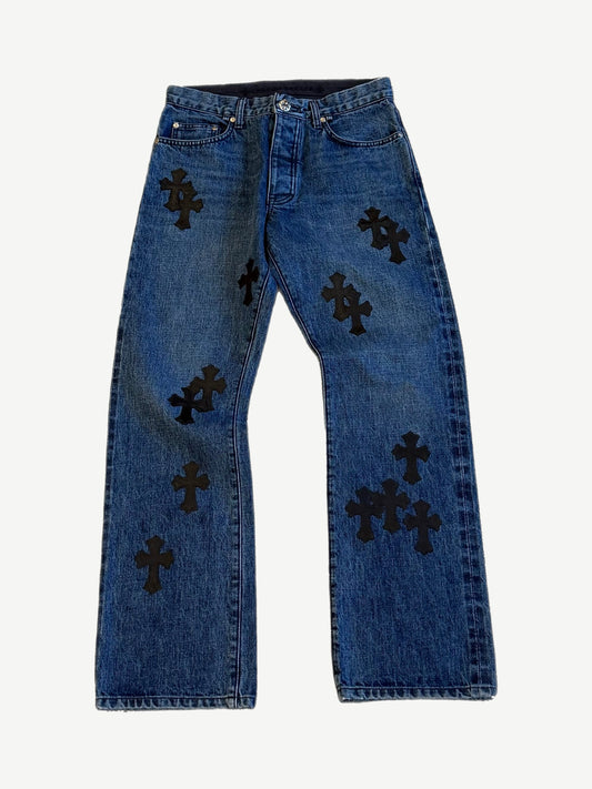 Chrome Hearts dark wash jeans front, indigo denim with scattered black leather cross patches