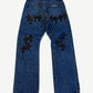 Chrome Hearts dark wash cross patch jeans back, indigo denim with black leather cross detailing