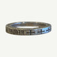 Side view of Chrome Hearts F You silver spacer ring showing engraved cross motifs around the band.