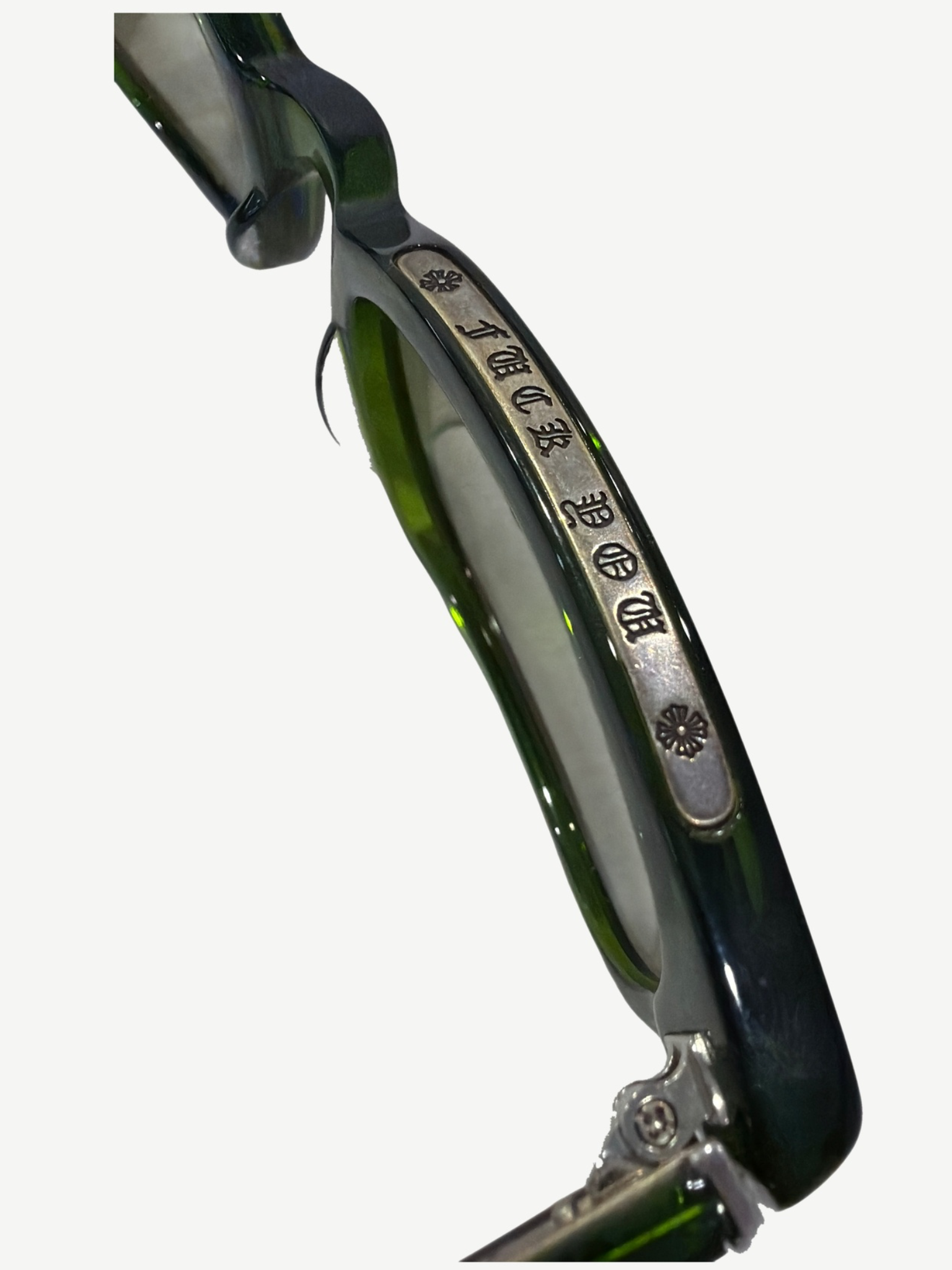 Chrome Hearts Lowrider green sunglasses side profile view with engraved silver temple plaque