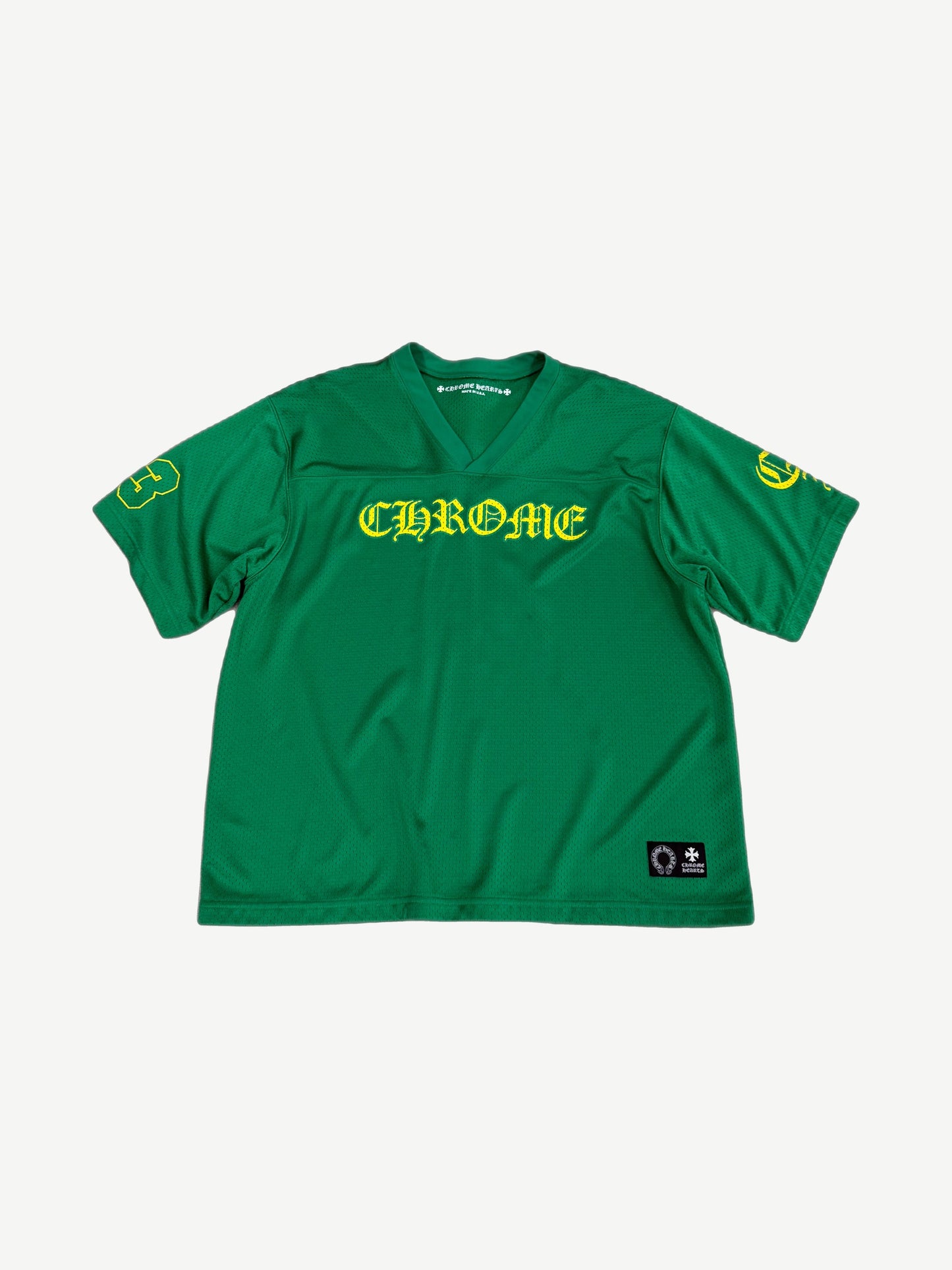 Chrome Hearts kelly green mesh football jersey front, yellow Old English CHROME chest print and number 3 sleeves.