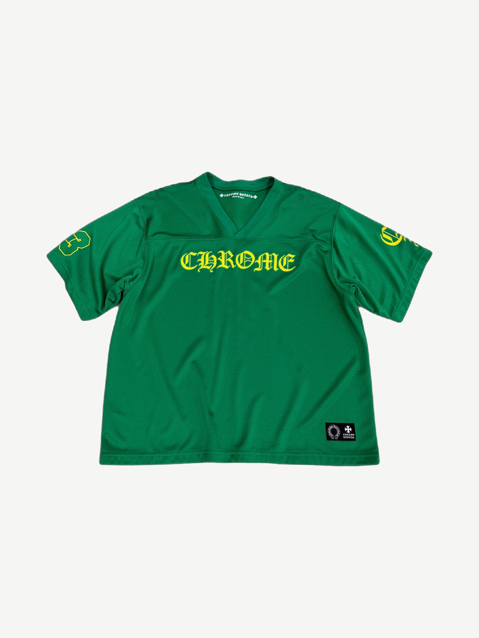 Chrome Hearts kelly green mesh football jersey front, yellow Old English CHROME chest print and number 3 sleeves.