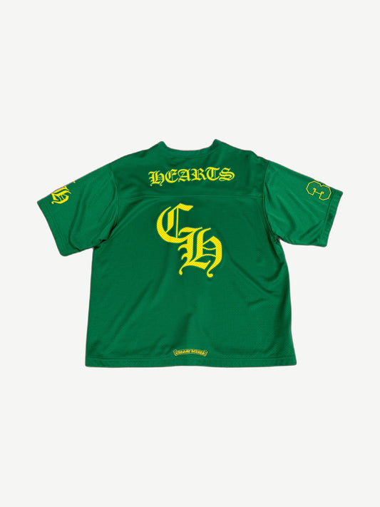 Chrome Hearts green mesh jersey back, large yellow HEARTS arch over Old English CH and numbered yellow sleeves.