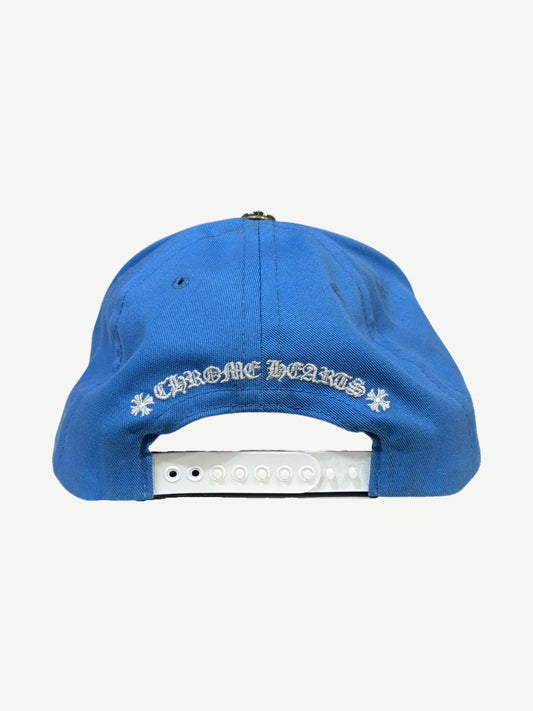 Chrome Hearts light blue cap back with white Chrome Hearts gothic script, cross flares, and snapback closure.