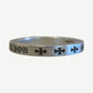 Chrome Hearts silver spacer ring side view with engraved YOU text and repeating cross motif details.