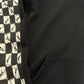 Chrome Hearts Matty Boy 99 Eyes hoodie detail, sleeve checkered eye motif and front kangaroo pocket close-up.