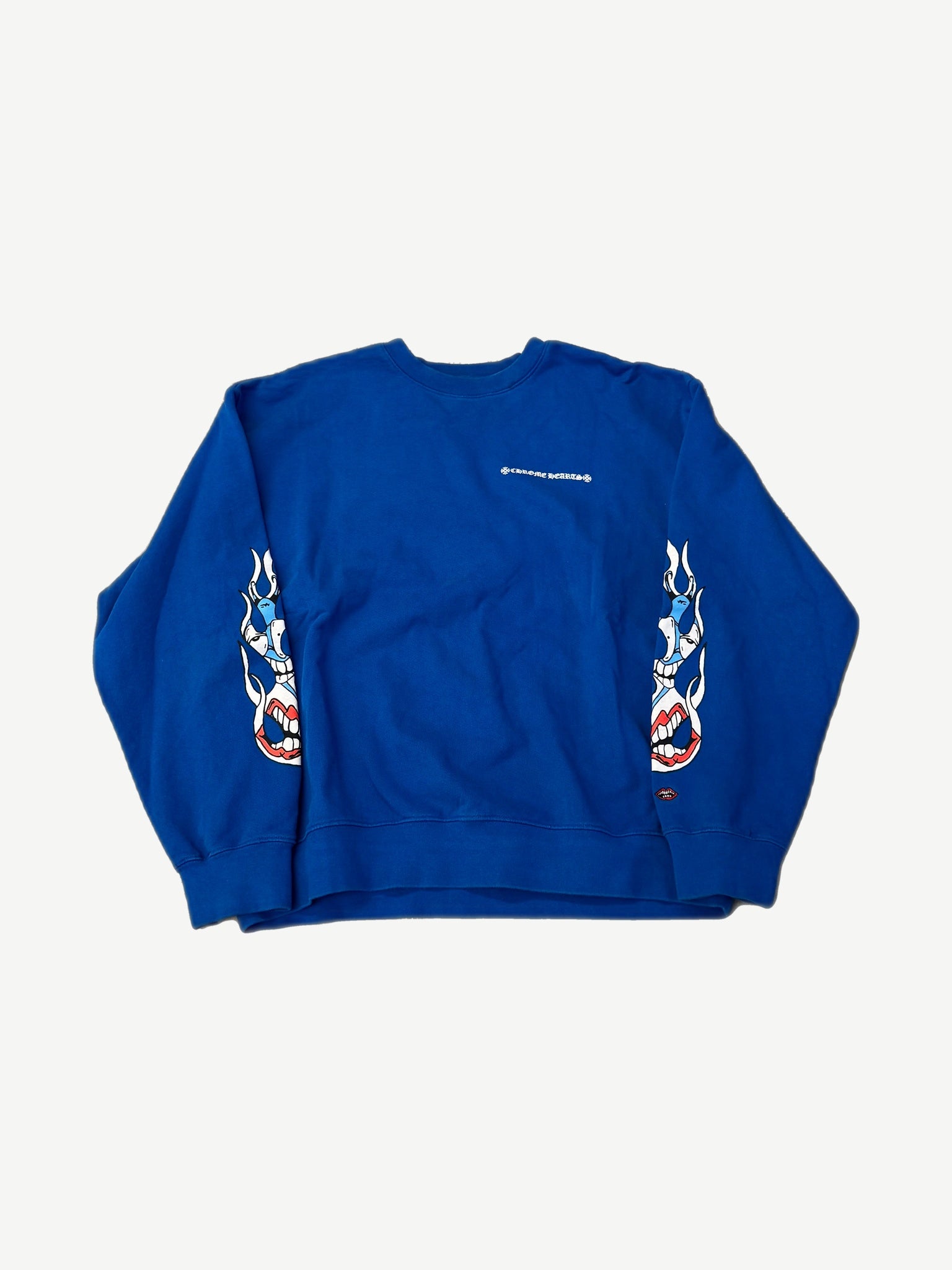 Chrome Hearts Matty Boy blue crewneck front with chest logo and twin flame skull sleeve prints