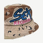 Chrome Hearts Sex Records camo bucket hat angled close up of leather patch stitching and camo ripstop